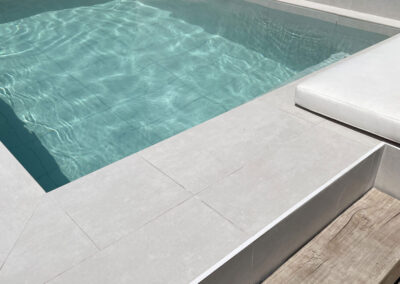 light grey rectangle outdoor tiles used on pool wall and floor from design di lusso watford outdoor tile shop